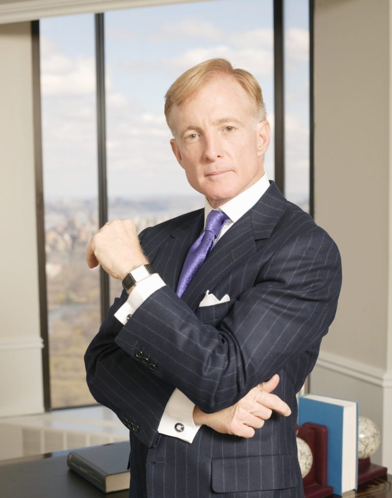 Bill Brewer poses for a photo in his New York City office on Fifth Avenue.