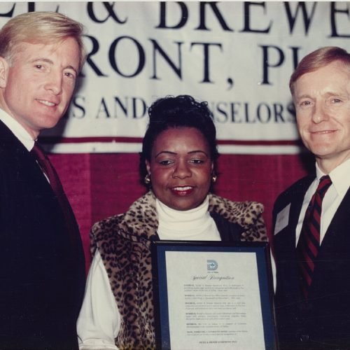 Bill and co-founder John Bickel receive an award on behalf of the Brewer Storefront, the firm's pro bono arm, founded in 1995.