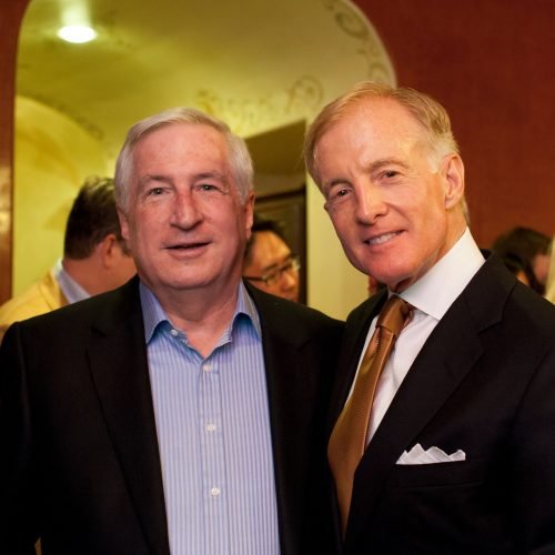 Bill with the firm's Chief Financial Officer, Michael McCormack, at an alumni party in 2013.