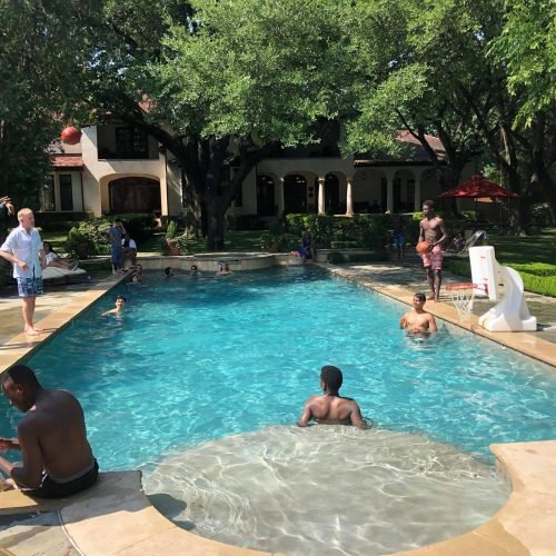 Bill with Brewer Foundation President Ian Shaw and FLP students at a summer party in 2018.